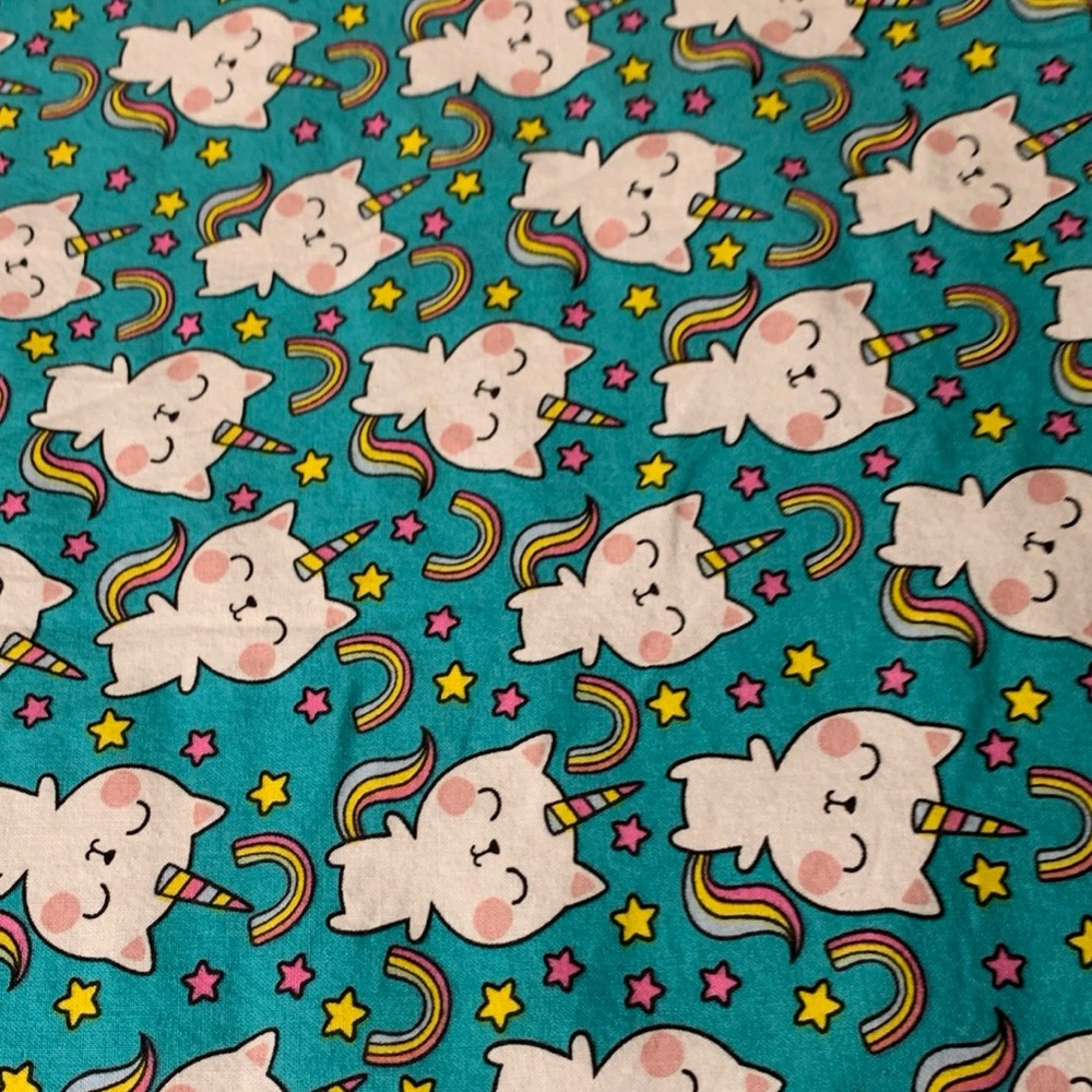 Colorful Unicorn cat and Rainbow Fabric on teal background 5 yards!